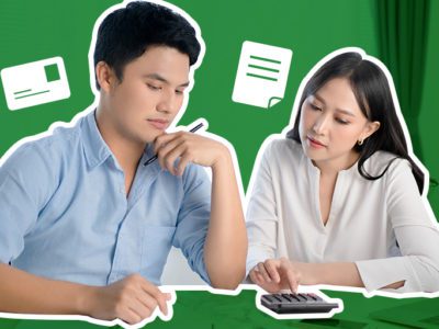 Asian Man and Woman computing taxes